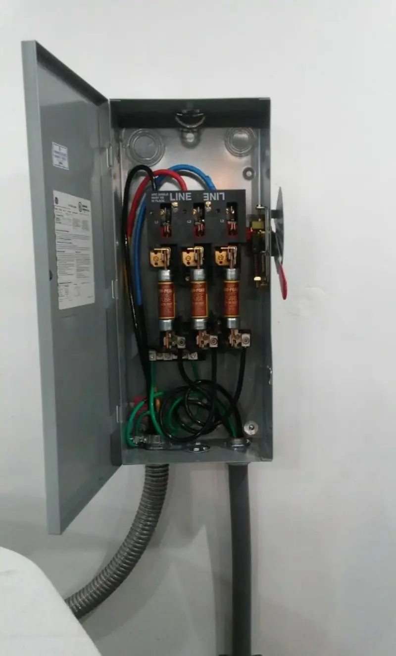 Three-phase disconnect switch installed for Smoke Detector Installation in Progress Village